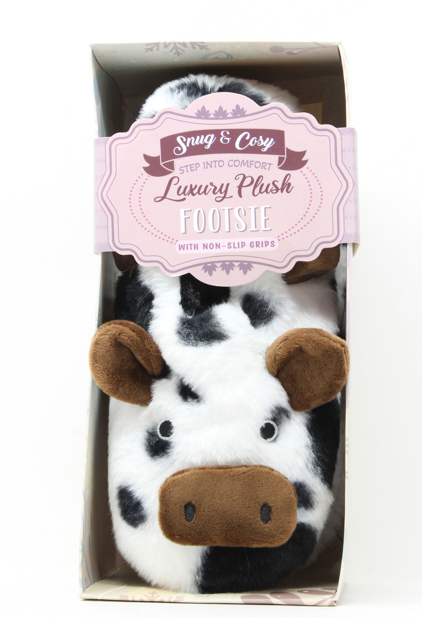 Cow-themed plush feeties in packaging with a visible brand label.