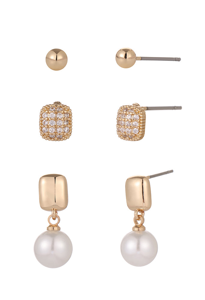 Set of gold and pearl earrings on a white background