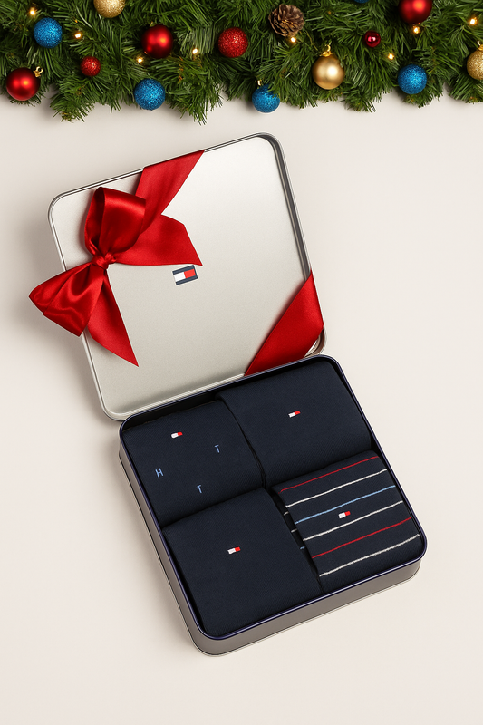 Set of gray socks in a metal box on a white background