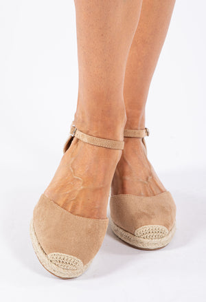 A camel espadrille style wedge sandal with a crochet look toe and an adjustable ankle strap.
