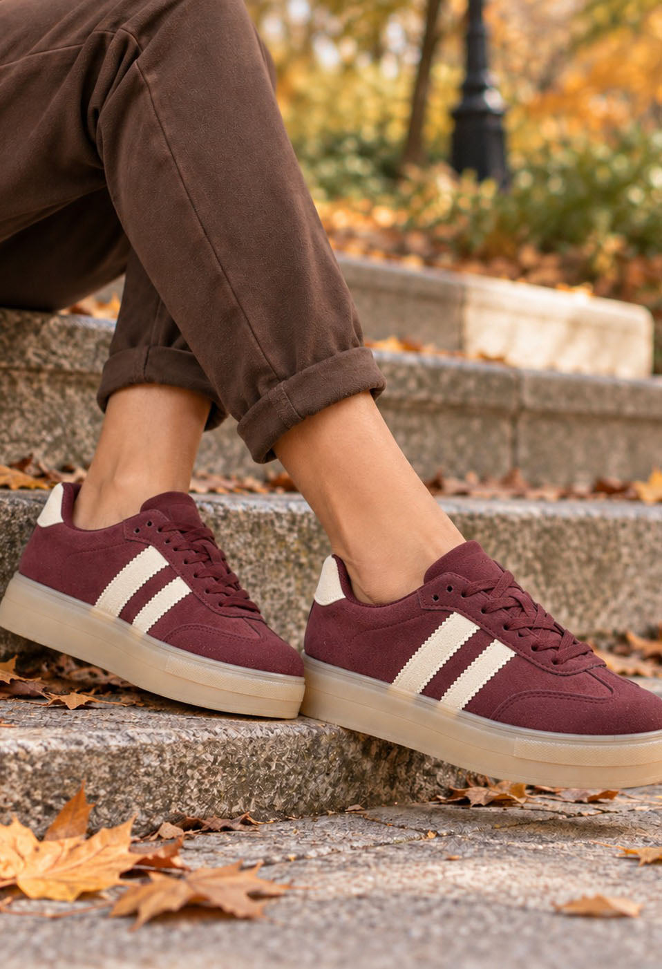 Burgundy platform sneakers on autumn steps – Pamela Scott