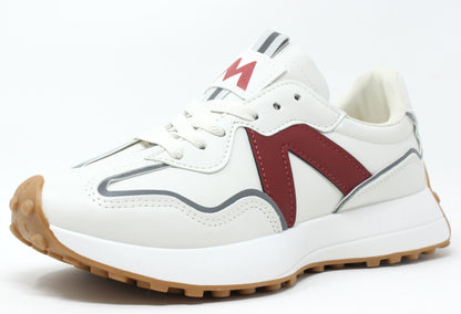 A white sneaker with red accents and a lace-up closure, featuring a slight platform sole and a faux leather finish.