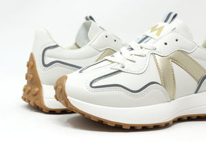 A pair of 'Wave Runner' sneakers featuring a faux leather finish, gold design, and a slight platform sole.