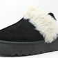 A black flatform slip on boot with fur lining around the top edge and an elastic ankle strap.