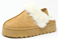 A camel flatform slip on boot with fur lining around the top edge and an elastic ankle strap.