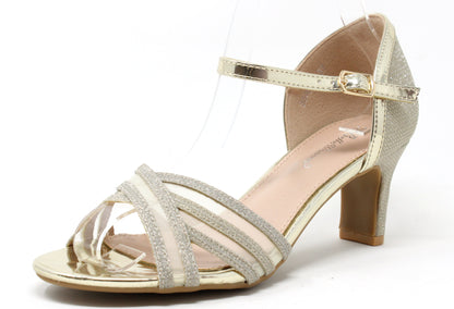 A gold shimmer ribbon heel with crossover toe traps, an adjustable ankle strap, and a slim heel.