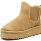 A camel faux fur lined slip on boot with an elasticated side panel and a round toe.