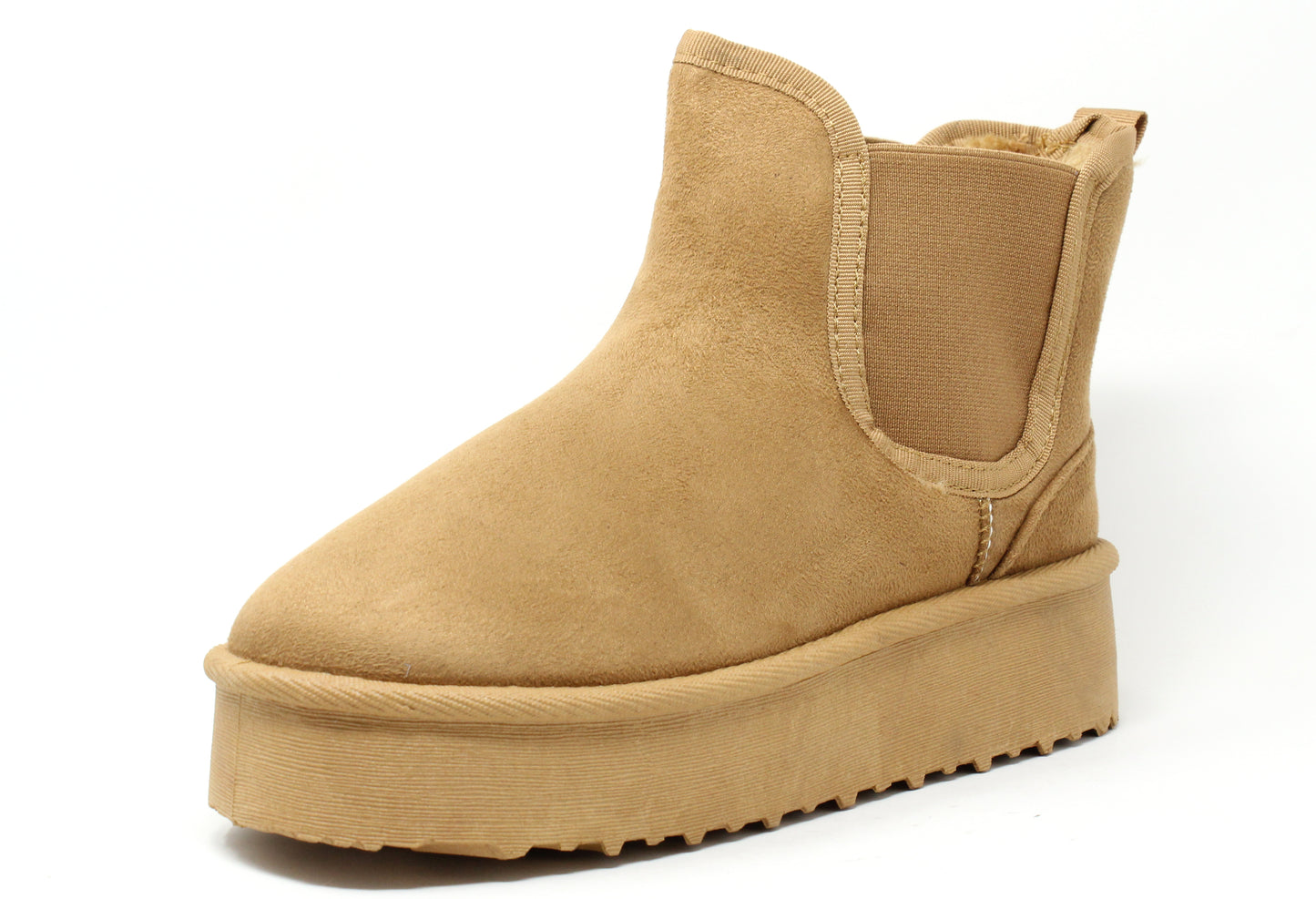 A camel faux fur lined slip on boot with an elasticated side panel and a round toe.