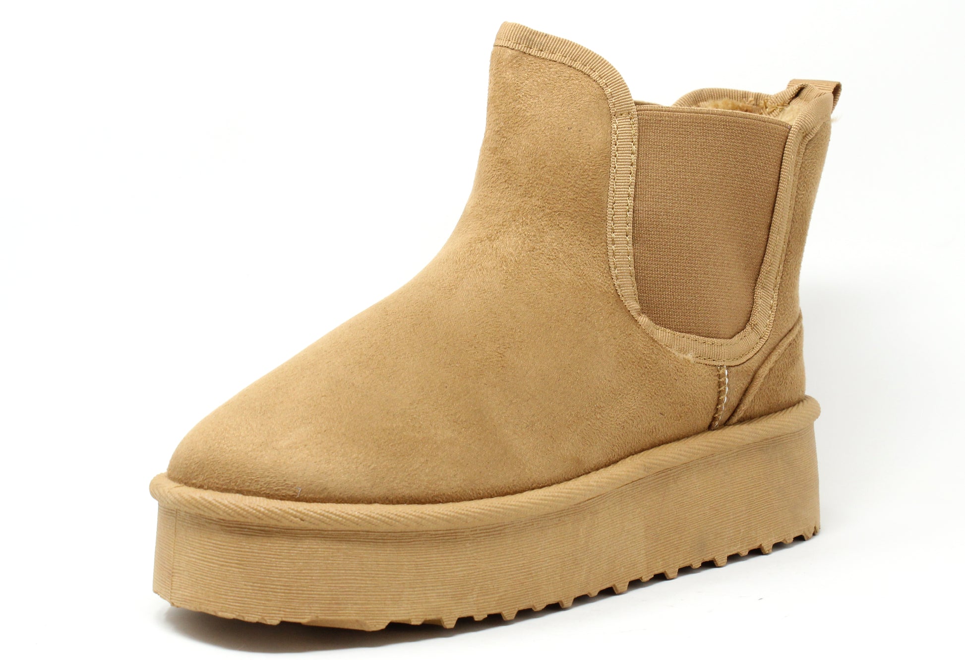 A camel faux fur lined slip on boot with an elasticated side panel and a round toe.