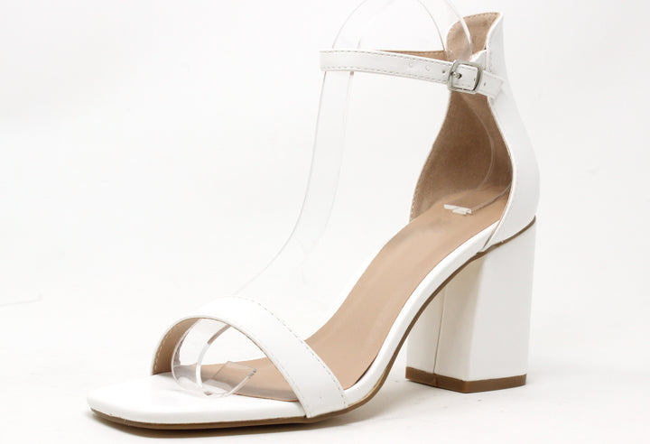 White sandal with block heel on a white background
