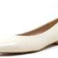 cream pointed ballerina shoe on a white background