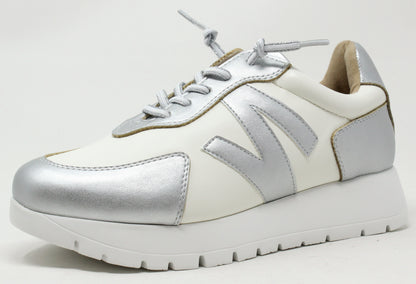 a white and silver detailed trainer with lace up and thicker white sole on a white background