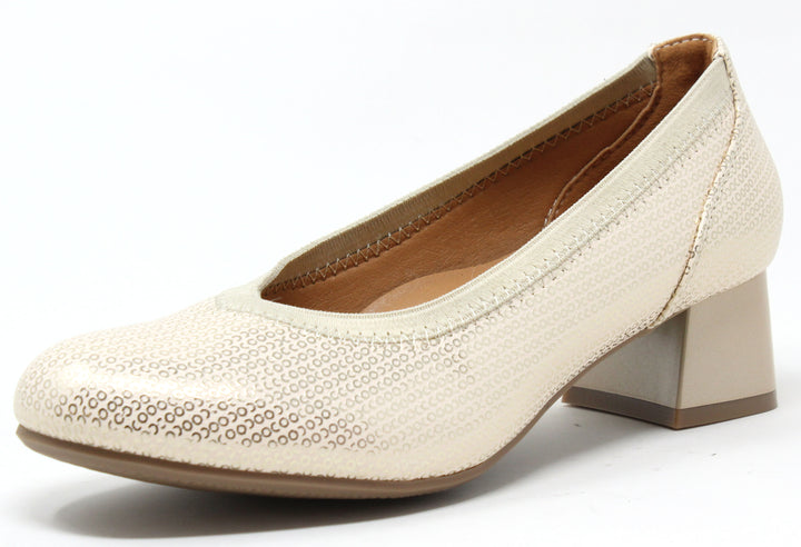 A gold metallic pump with a round toe and low block heel.