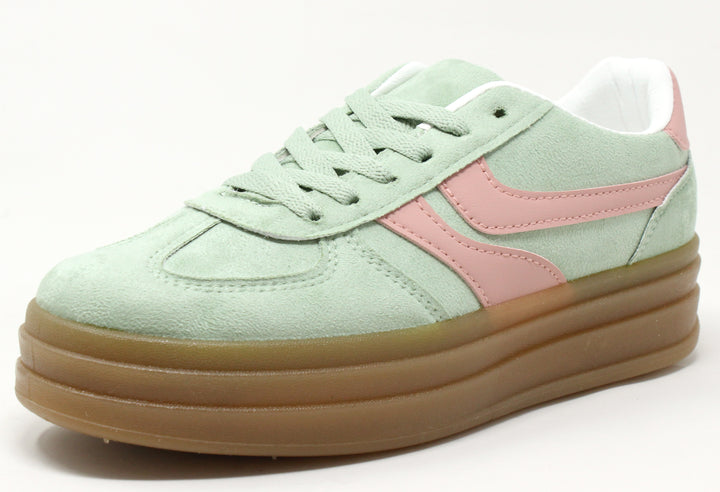 A pair of color-blocked platform sneakers with faux suede texture, lace-up closure, and a thick sole.