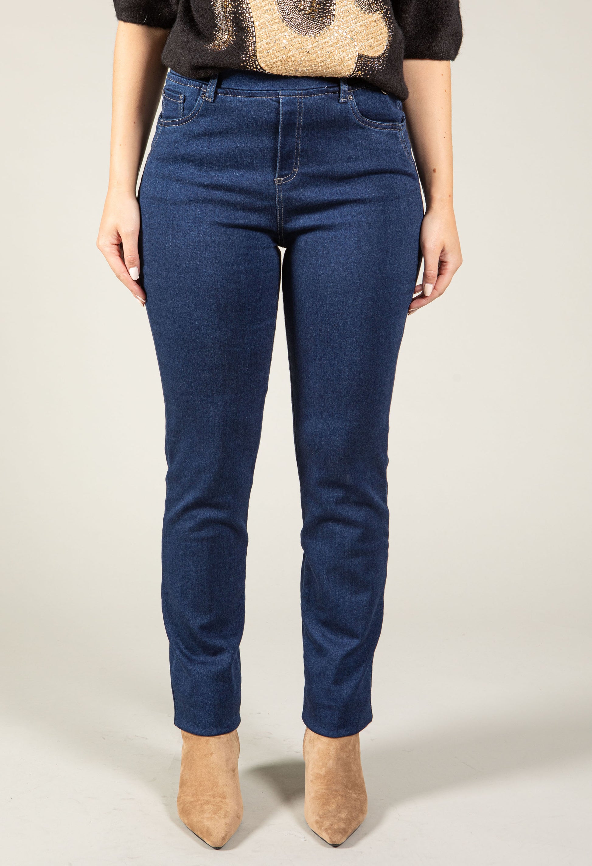 woman wearing a stone wash denim pull on trouser