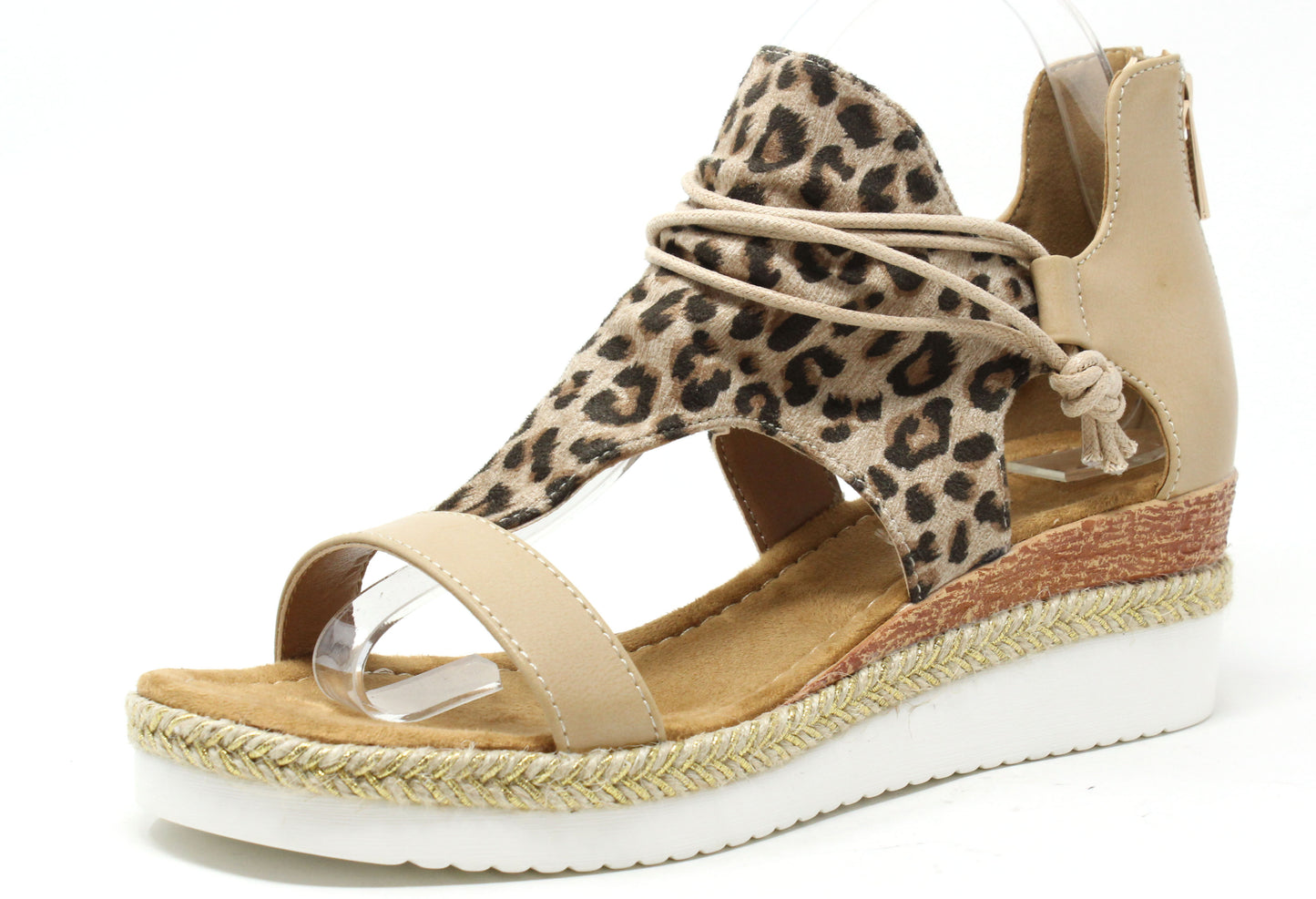 Leopard print sandal with a woven sole on a white background