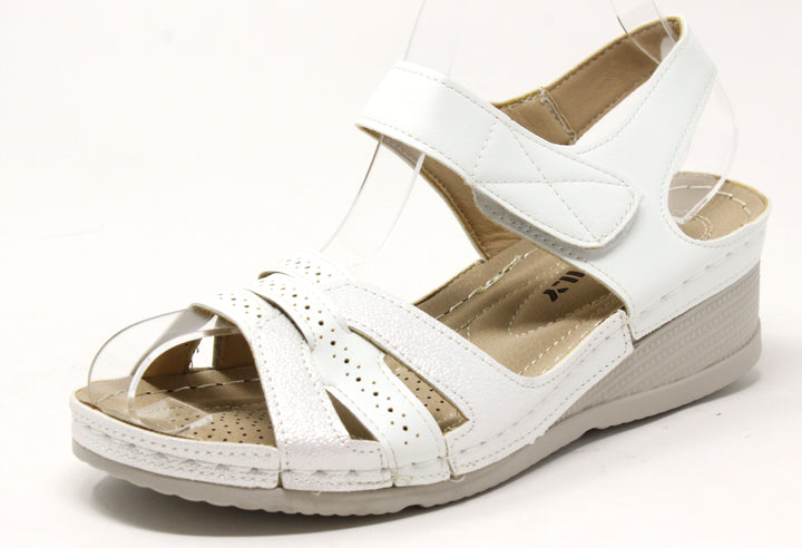 A pair of blue comfort cross strap sandals with Velcro closures, laser details, and a lightweight flexible sole.