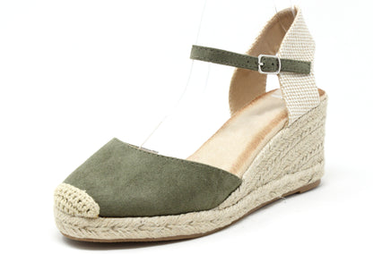 Green wedge sandal with espadrille sole on a white background