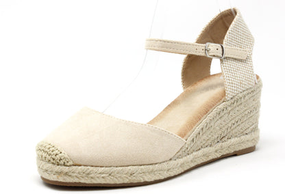 Beige wedge sandal with espadrille sole on a white background