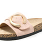 Pink sandal with a gold buckle on a white background