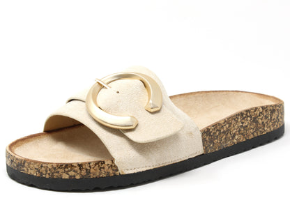 Beige slide sandal with a gold buckle on a white background
