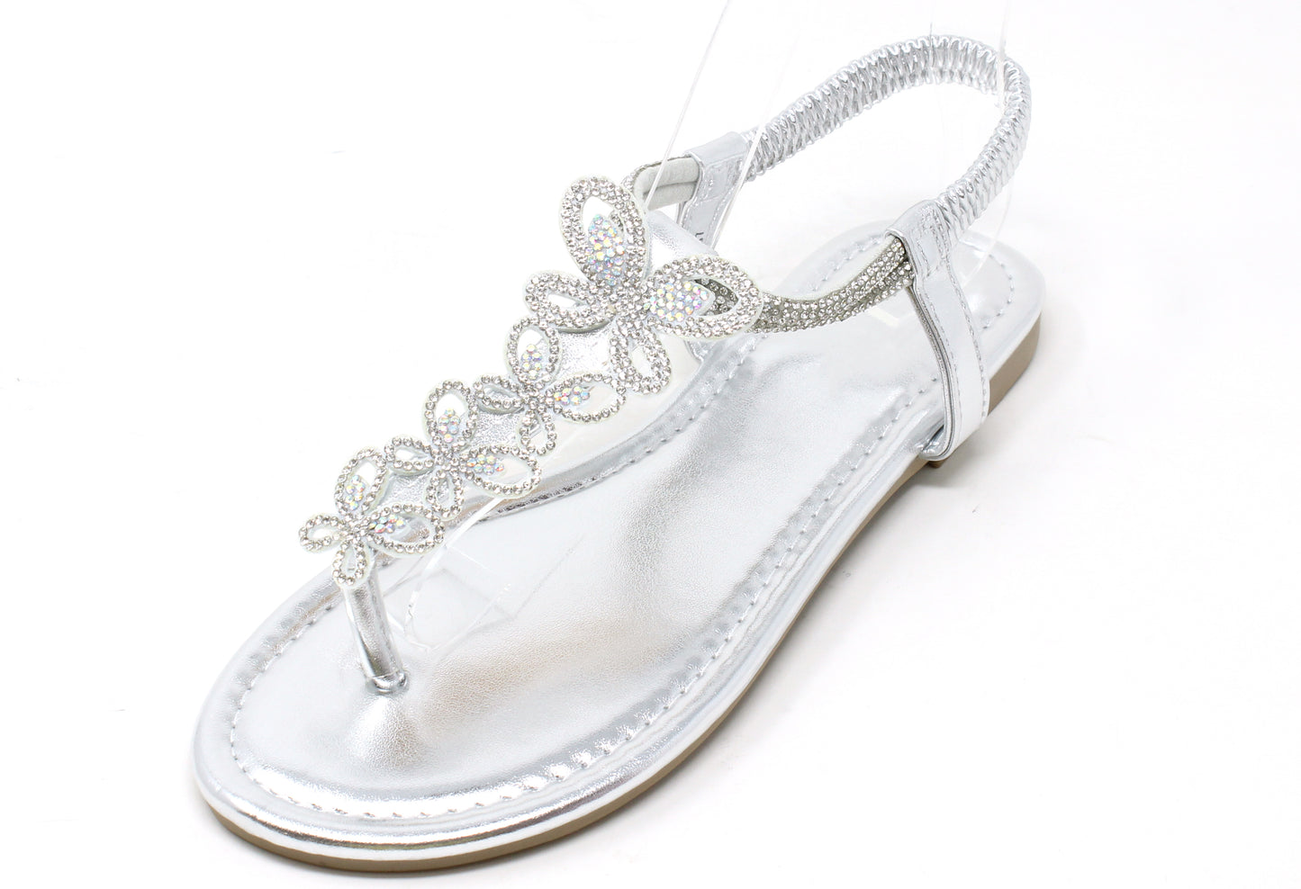 Silver sandal with decorative straps on a white background