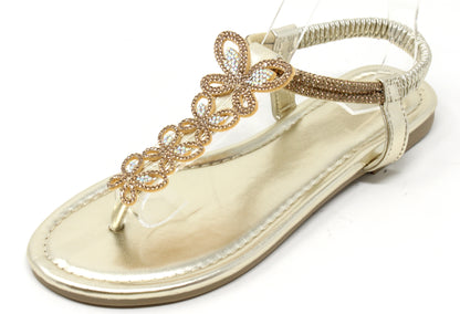 Gold sandal with decorative straps on a white background
