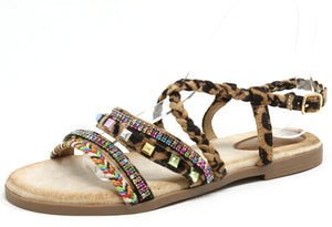 Leopard print sandal with colorful embellishments on a white background