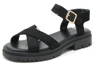 Black sandal with a gold buckle on a white background