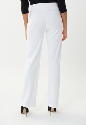 White pants worn by a person on a white background