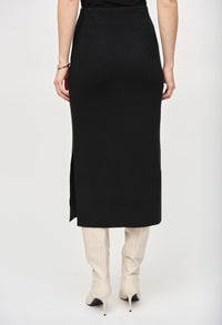 Person wearing a black skirt with a white background