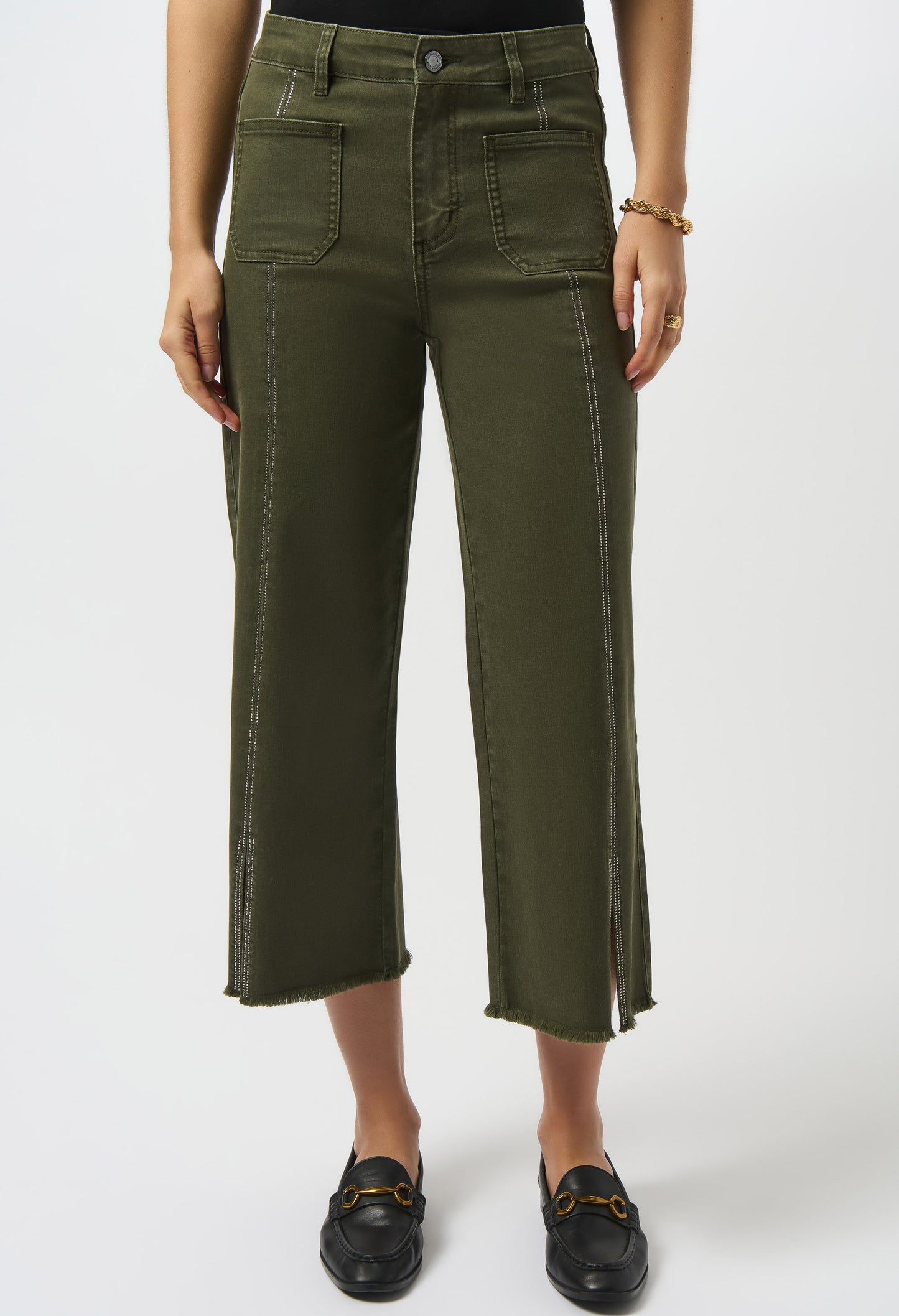 Person wearing green pants on a white background