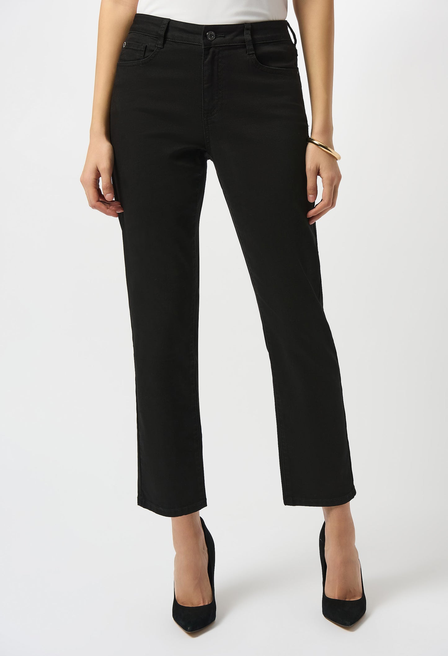 Person wearing black pants on a white background