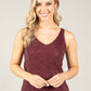 woman wearing burgundy sparkle cami top