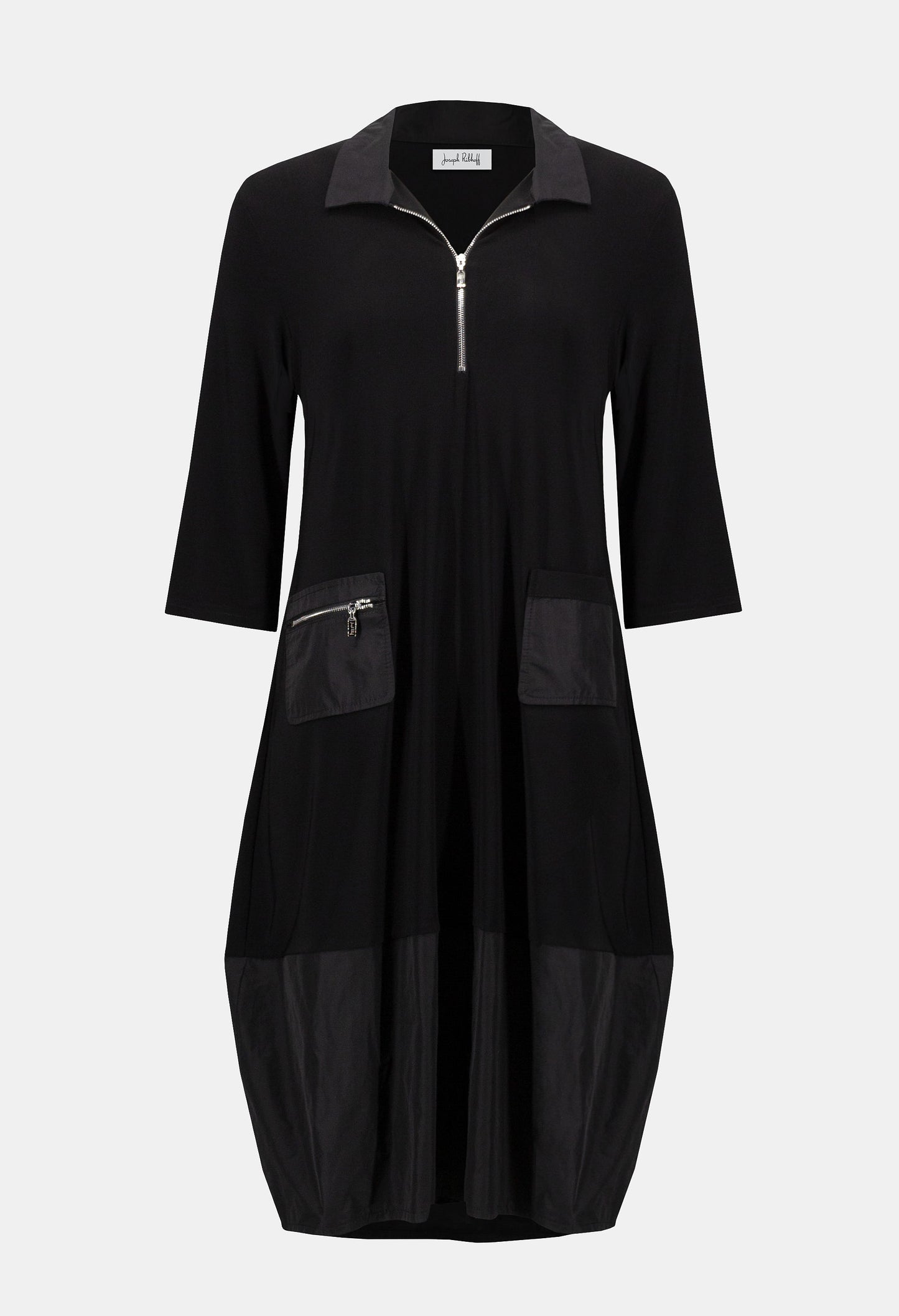 Black dress with zippers on a light gray background