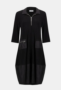 Black dress with zippers on a light gray background