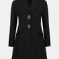 Black coat with silver buttons on a white background