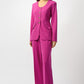 Woman wearing a bright pink suit on a white background