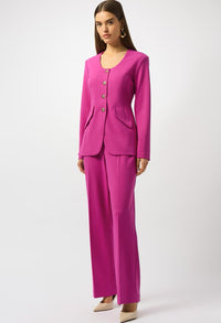 Woman wearing a bright pink suit on a white background