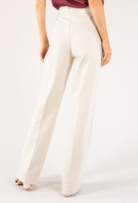 White pants worn by a person on a white background