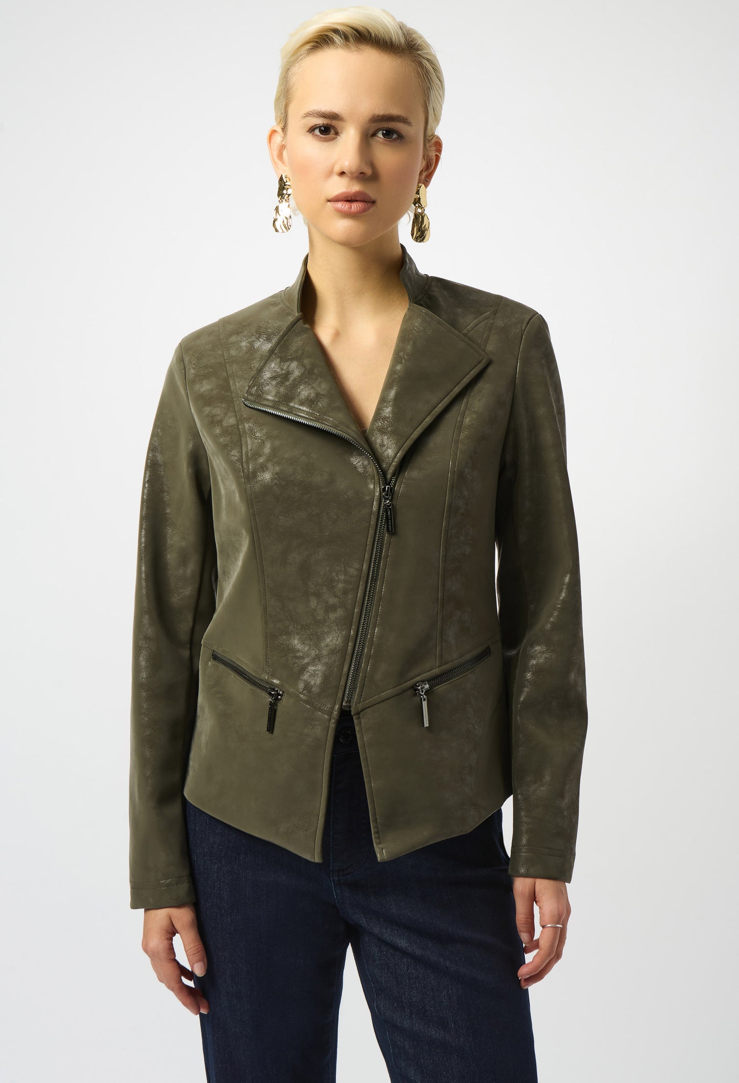Woman wearing a green leather jacket on a white background
