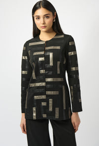 Woman wearing a black and gold patterned top on a white background