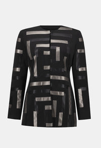 Black and silver geometric patterned dress on a white background