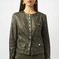 Woman wearing an olive green jacket and pants on a white background