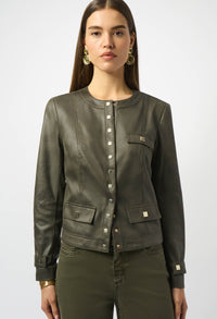 Woman wearing an olive green jacket and pants on a white background