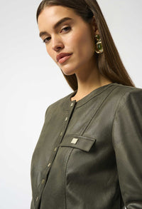 Woman wearing a green jacket with a close-up of the brand logo on a white background