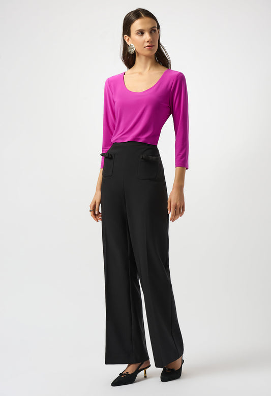 Woman wearing a black outfit on a white background