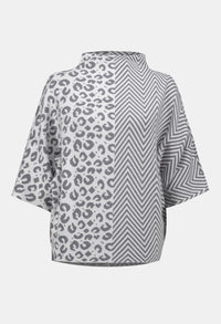Gray poncho with leopard print and zigzag pattern on a white background