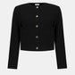 Black cropped cardigan with button details on a white background