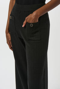 Black pants with a close-up of a pocket on a white background